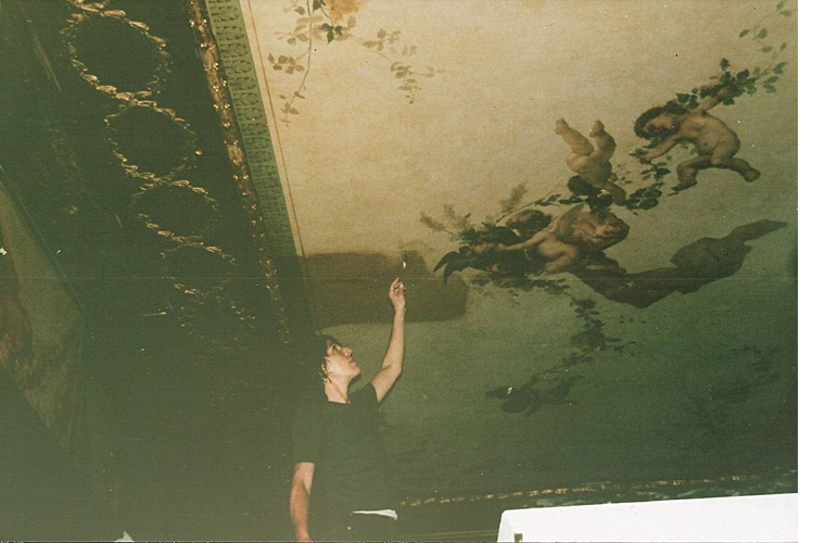 Cleaning off the last section of grime, nicotine and altered varnish (by Q-tip) on the Chelsea Hotel office ceiling, formerly the Ladies Powder room, circa 1889.<br />Chelsea Hotel, New York City.<br /><br />Please click on each photo to advance >>